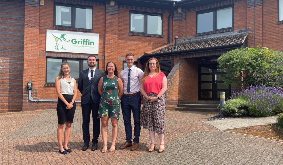 Group of people outside an Exeter office