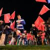 Rugby players running out onto rugby pitch