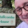 Man in front of sign for Stallcombe House